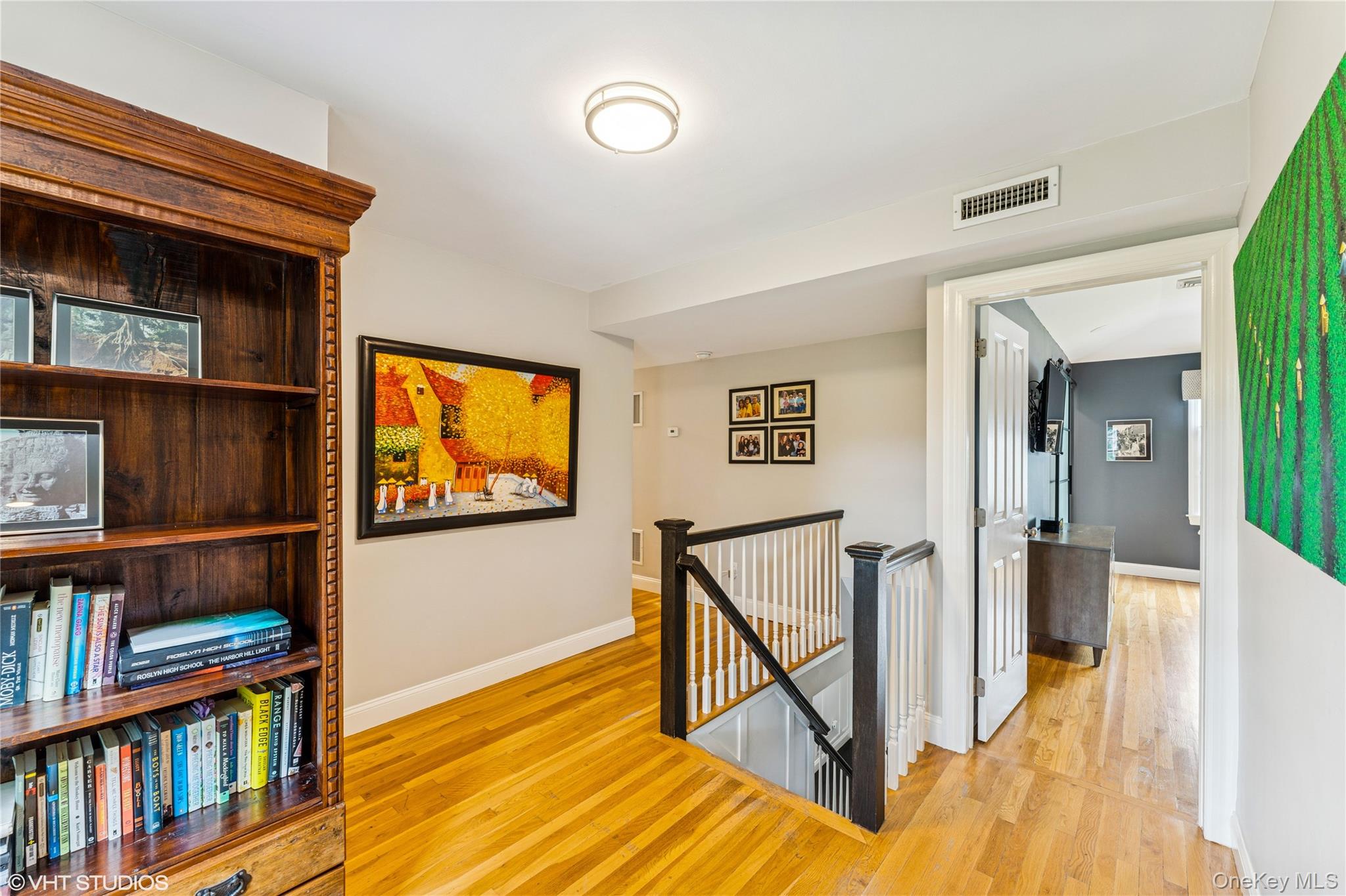 15 Flamingo Road East Hills, NY 11576 - Photo 19 of 41 Hall featuring an upstairs landing and wood floors