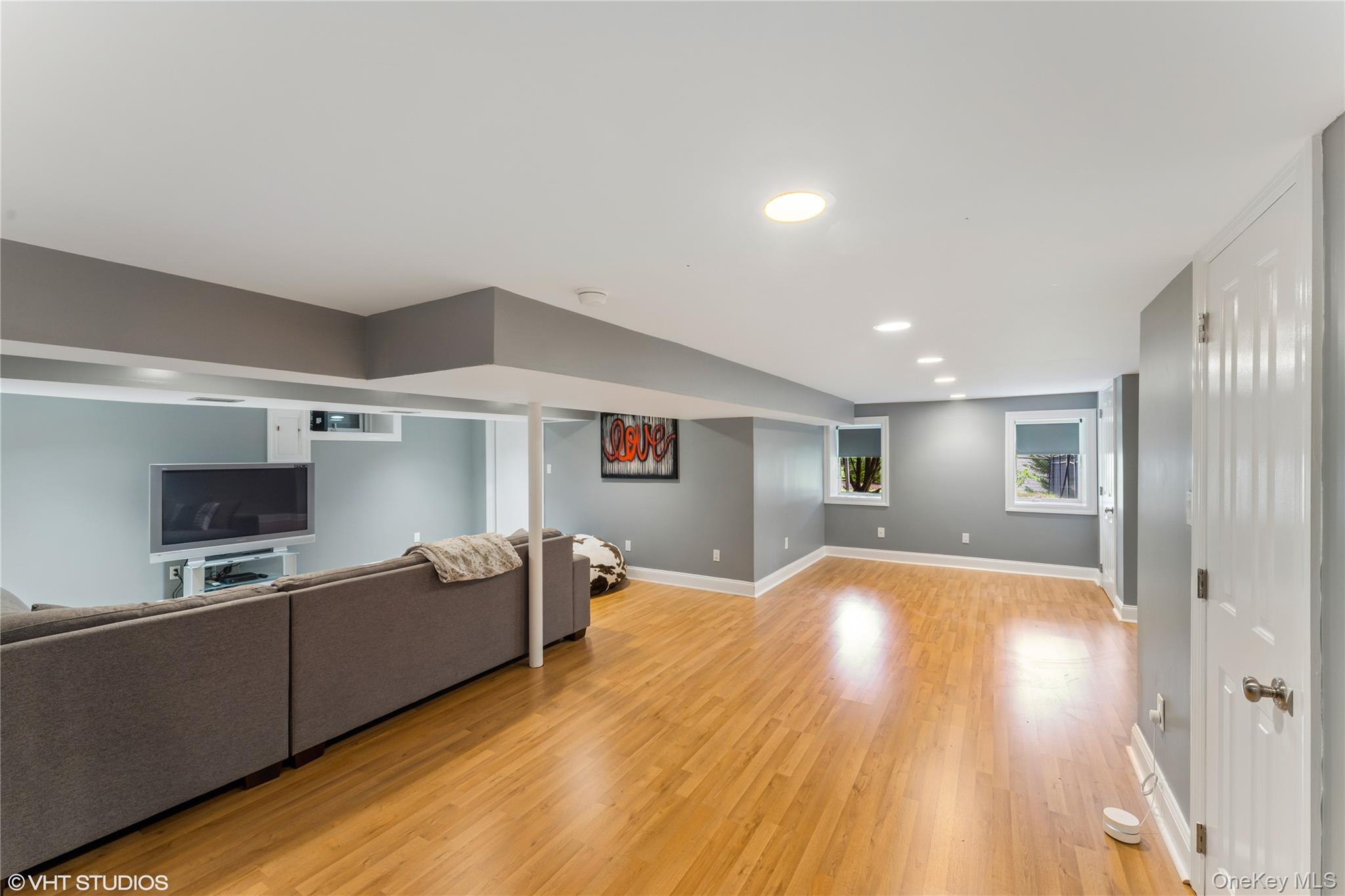 15 Flamingo Road East Hills, NY 11576 - Photo 34 of 41 Living area featuring recessed lighting and light flooring