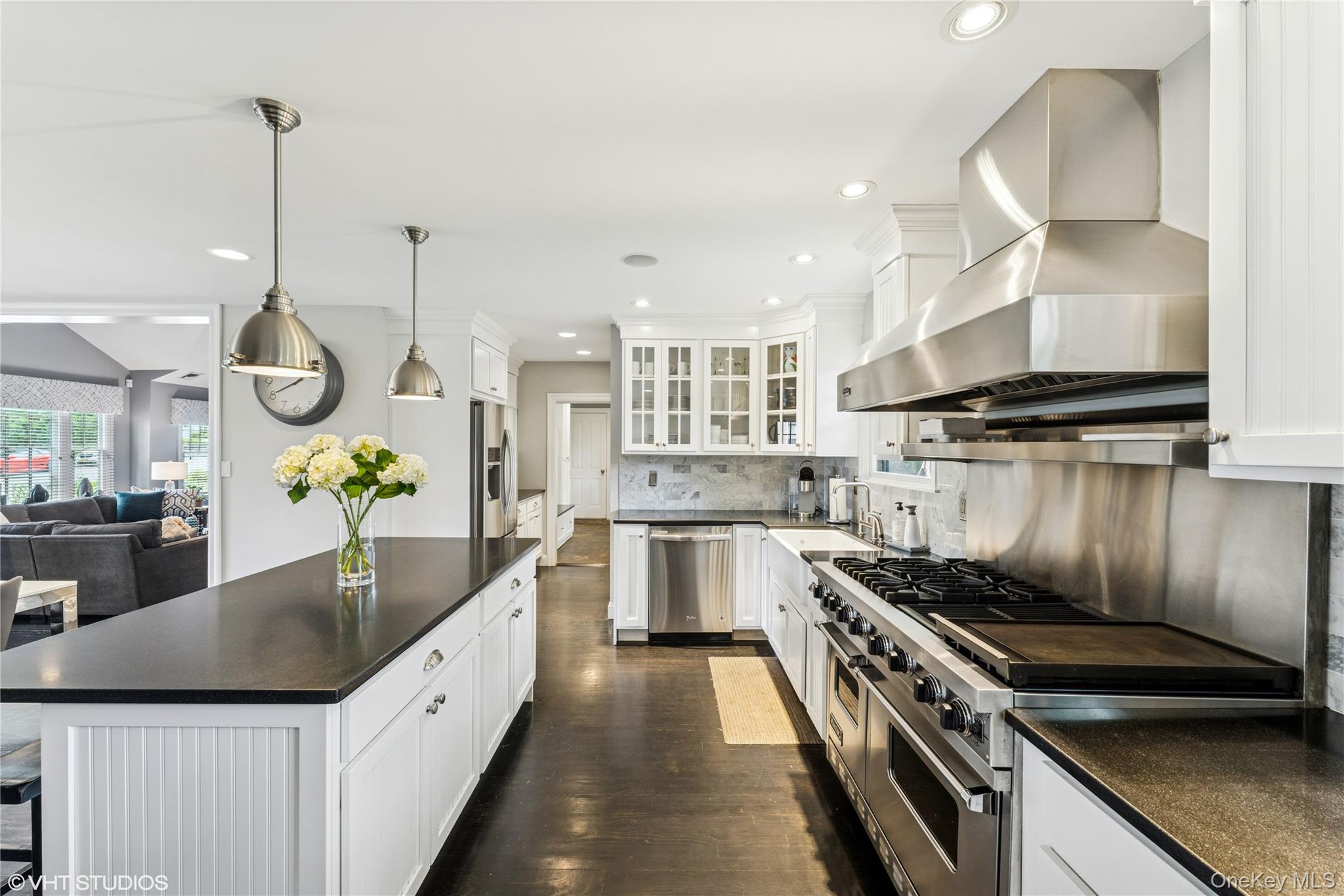 15 Flamingo Road East Hills, NY 11576 - Photo 5 of 41 Kitchen with stainless steel appliances, a breakfast bar area, ventilation hood, white cabinetry, and recessed lighting