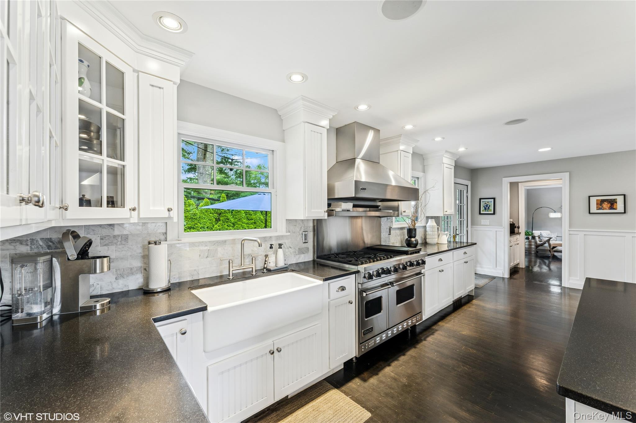 15 Flamingo Road East Hills, NY 11576 - Photo 7 of 41 Kitchen with wall range hood, range with two ovens, glass insert cabinets, white cabinetry, and recessed lighting
