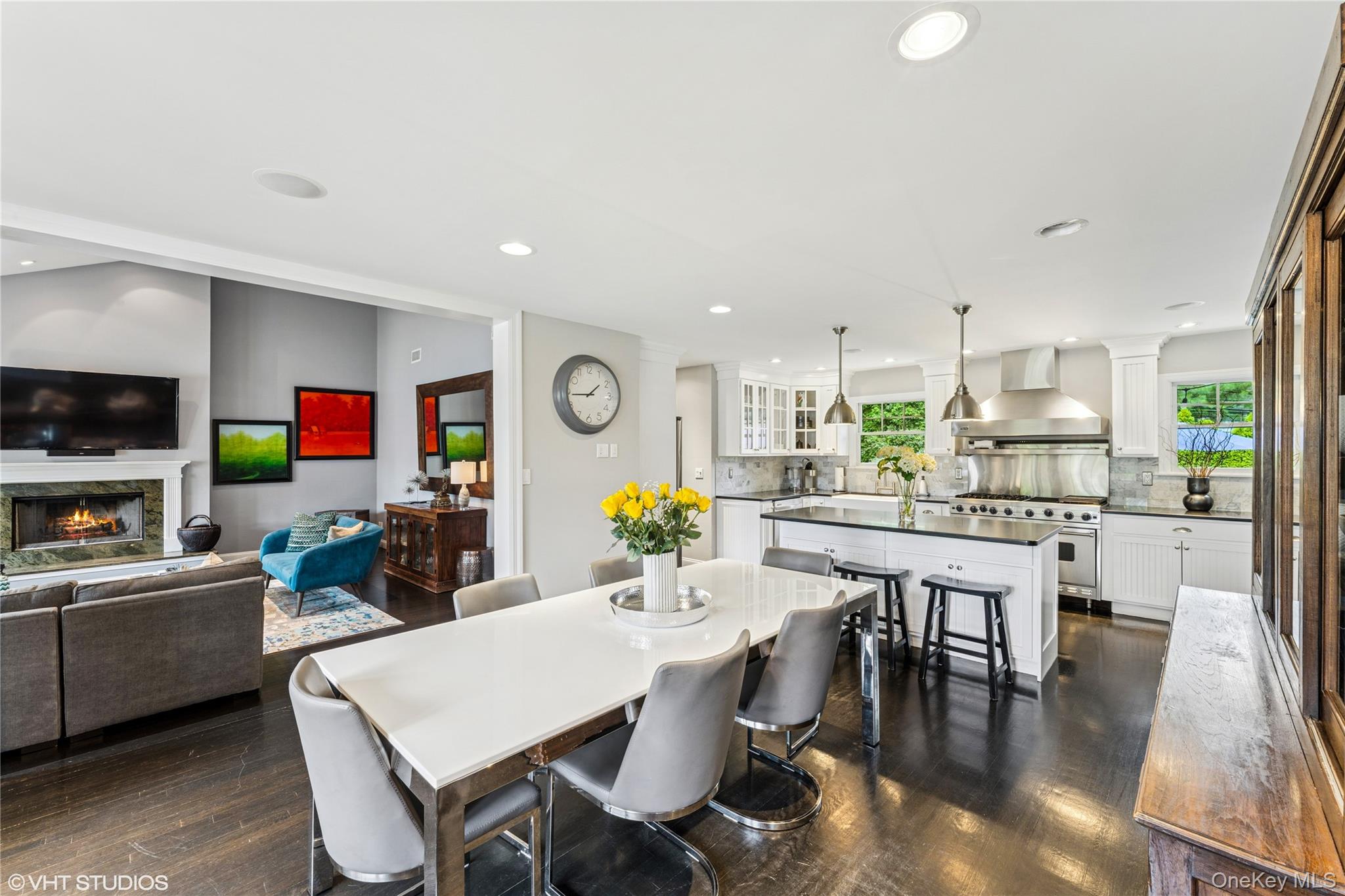 15 Flamingo Road East Hills, NY 11576 - Photo 9 of 41 Dining space with dark wood-style floors, recessed lighting, and a premium fireplace