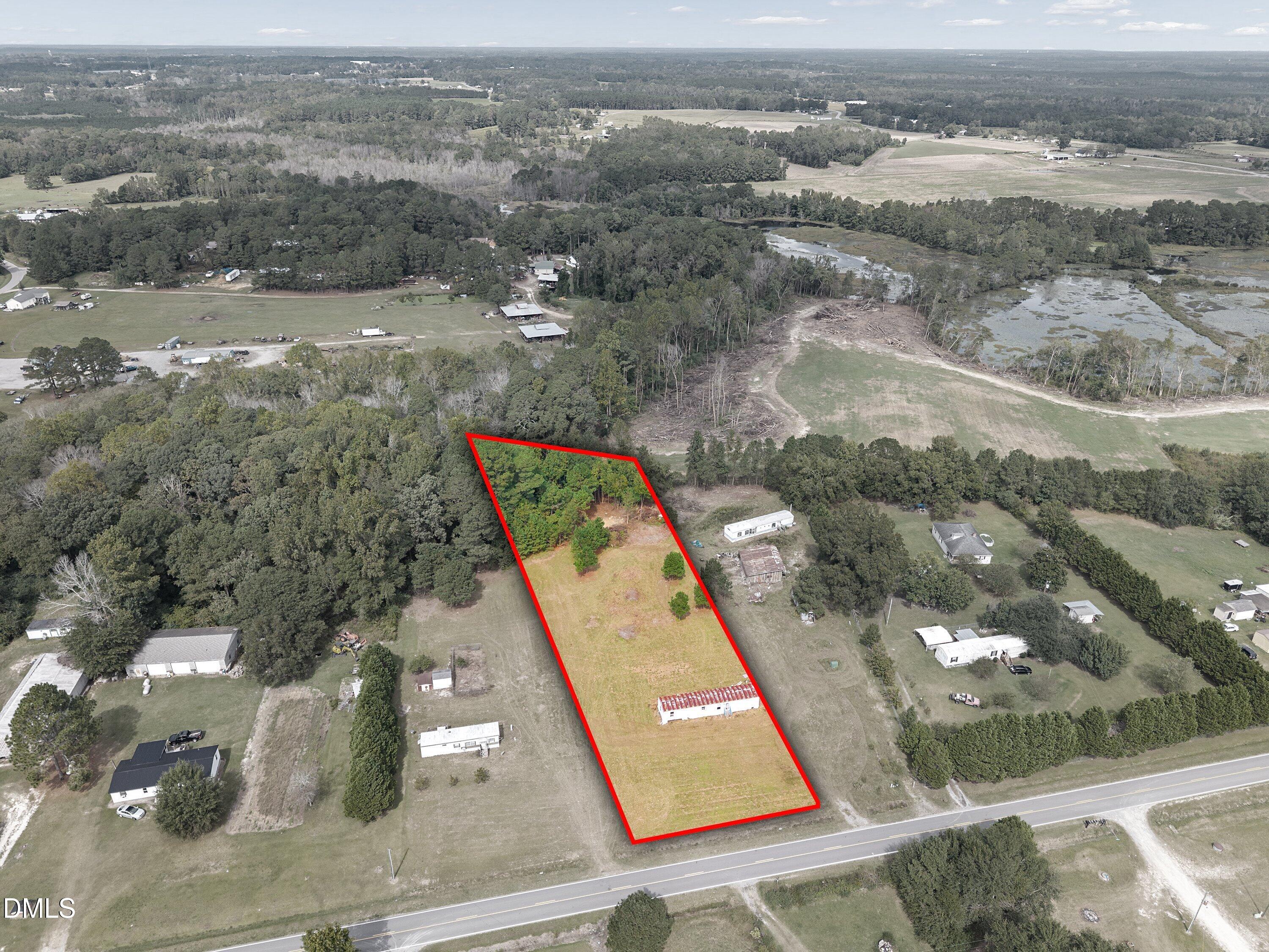 460 Webb Mill Road Four Oaks, NC 27524 - Photo 2 of 6 an aerial view of residential houses with outdoor space