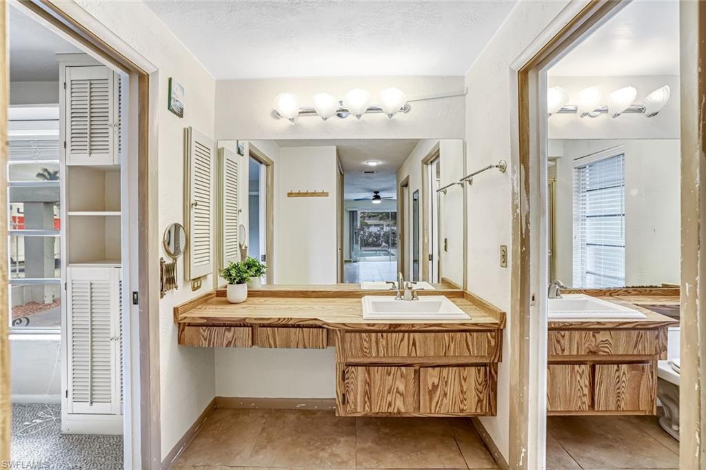 196 Baltusrol Drive Naples, FL 34113 - Photo 12 of 20 Full bath featuring vanity