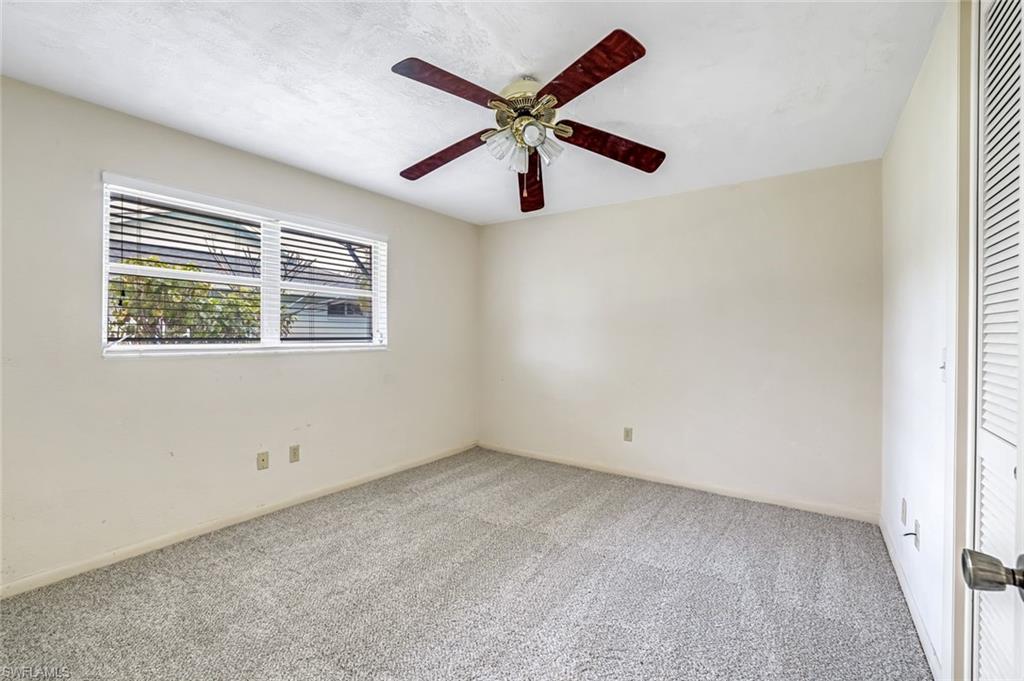 196 Baltusrol Drive Naples, FL 34113 - Photo 14 of 20 Guest bedroom with new carpet
