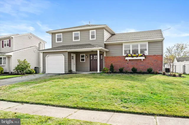 a front view of house with outdoor space and seating area