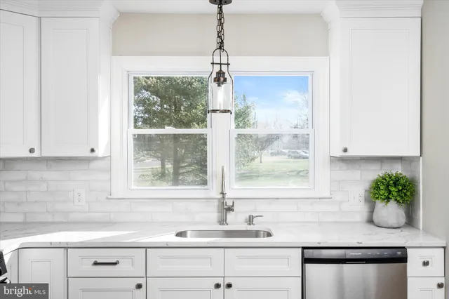 a kitchen with a sink and a window