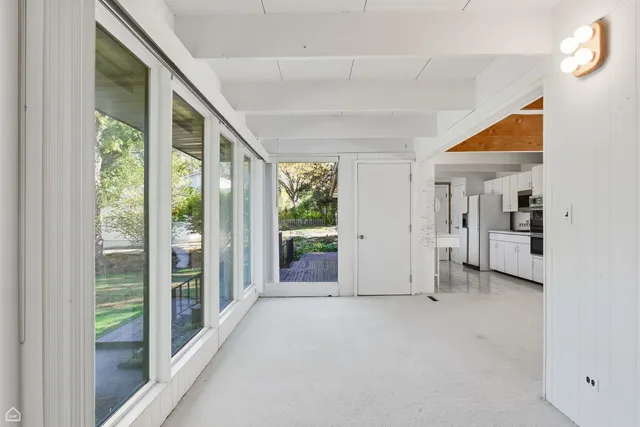 a kitchen with a sink and large window