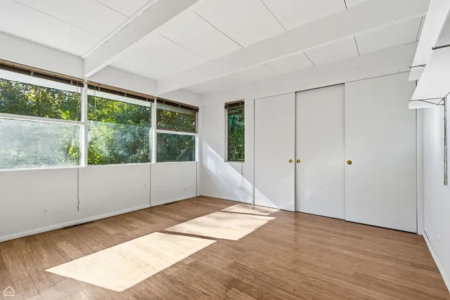 a view of an empty room with a window