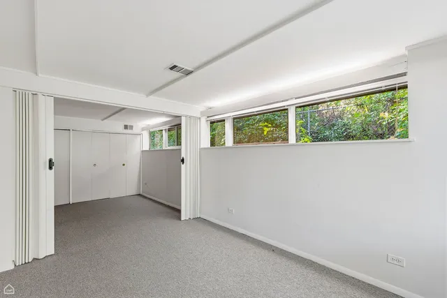 a bathroom with a double vanity sink toilet and shower
