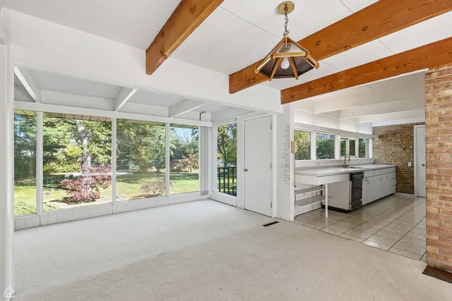 a view of empty room with floor to ceiling window