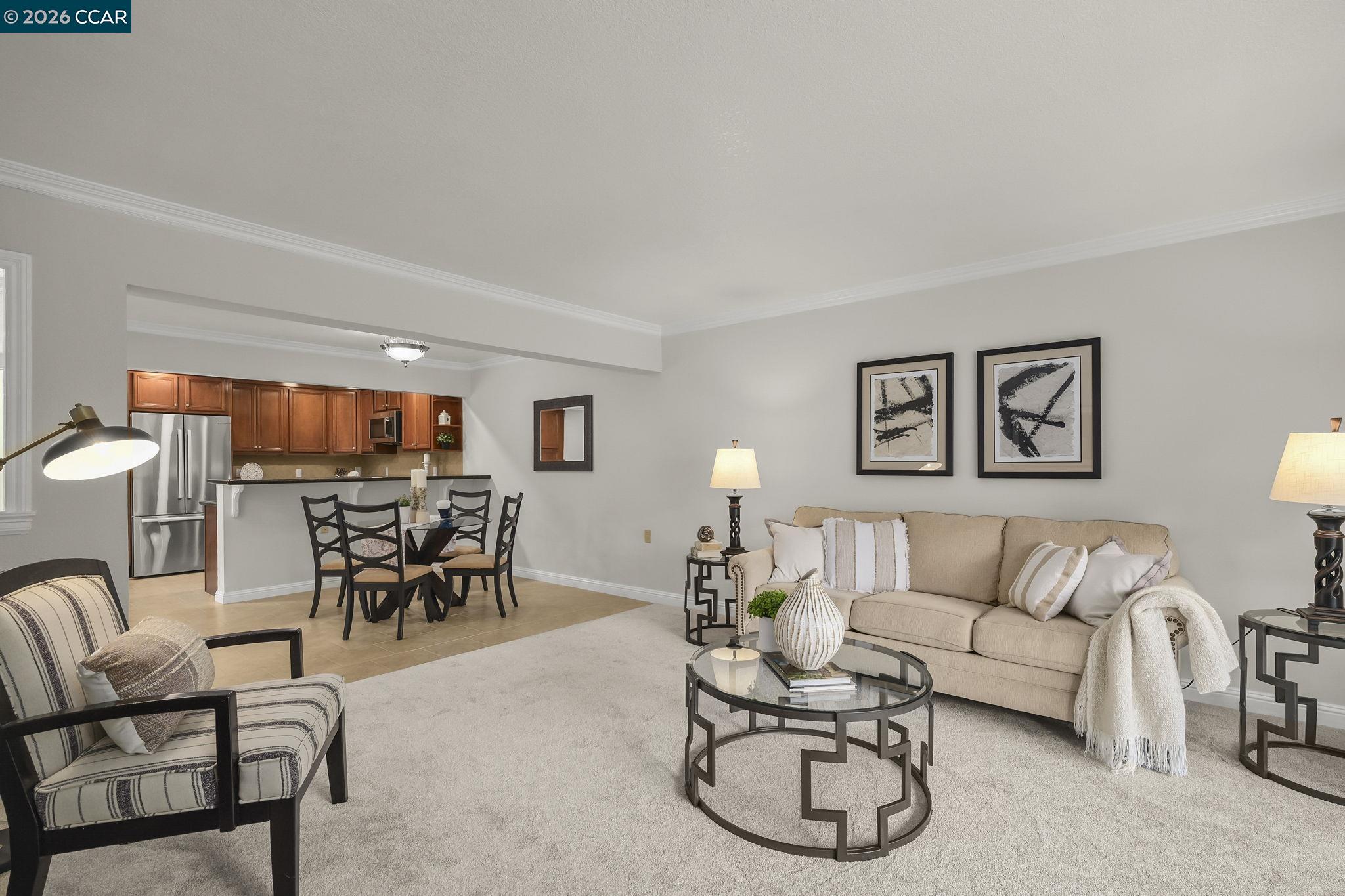 2057 Golden Rain Road, Unit 4 Walnut Creek, CA 94595 - Photo 14 of 20 a living room with furniture a rug and a window