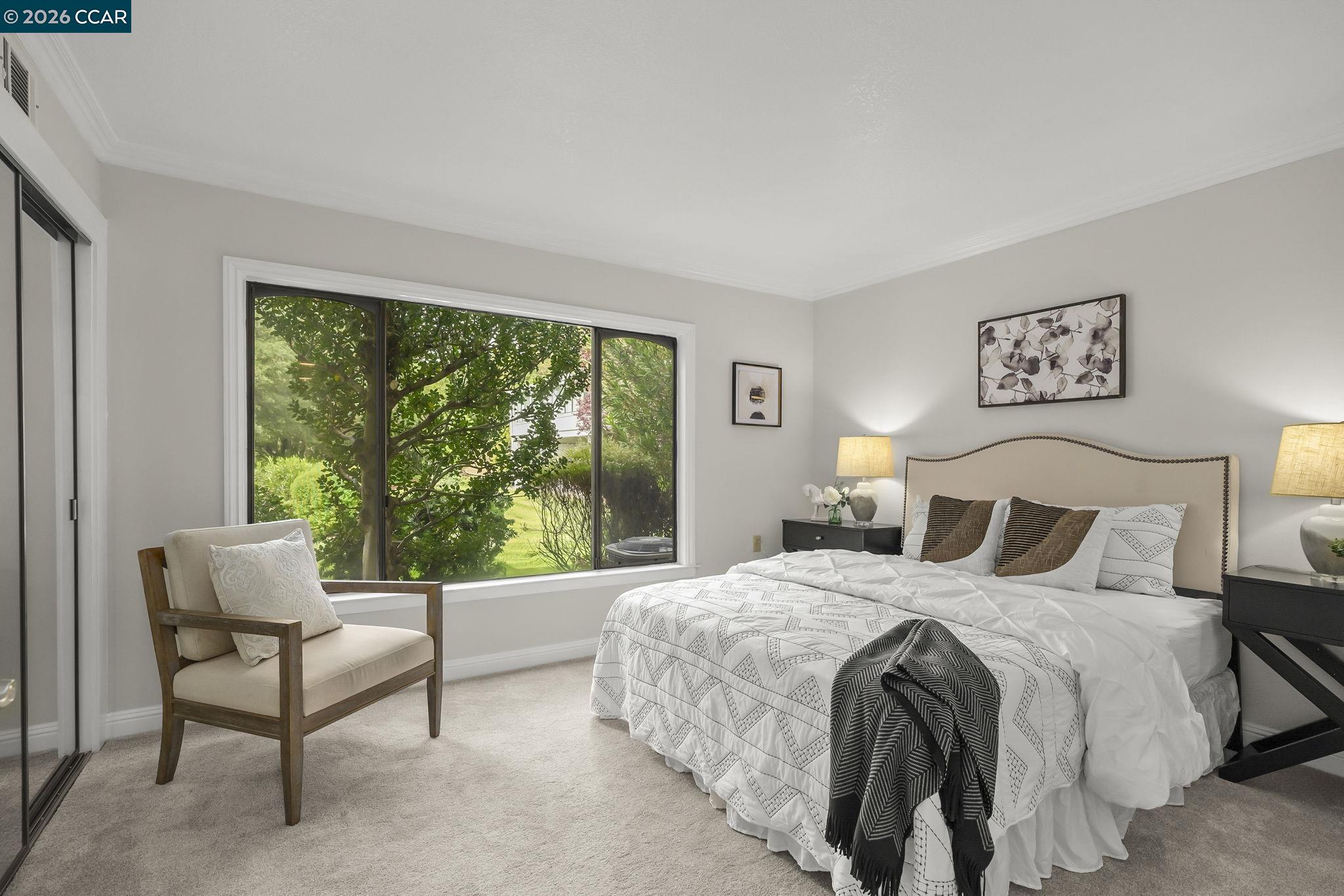 2057 Golden Rain Road, Unit 4 Walnut Creek, CA 94595 - Photo 15 of 20 a bedroom with a bed and a large window