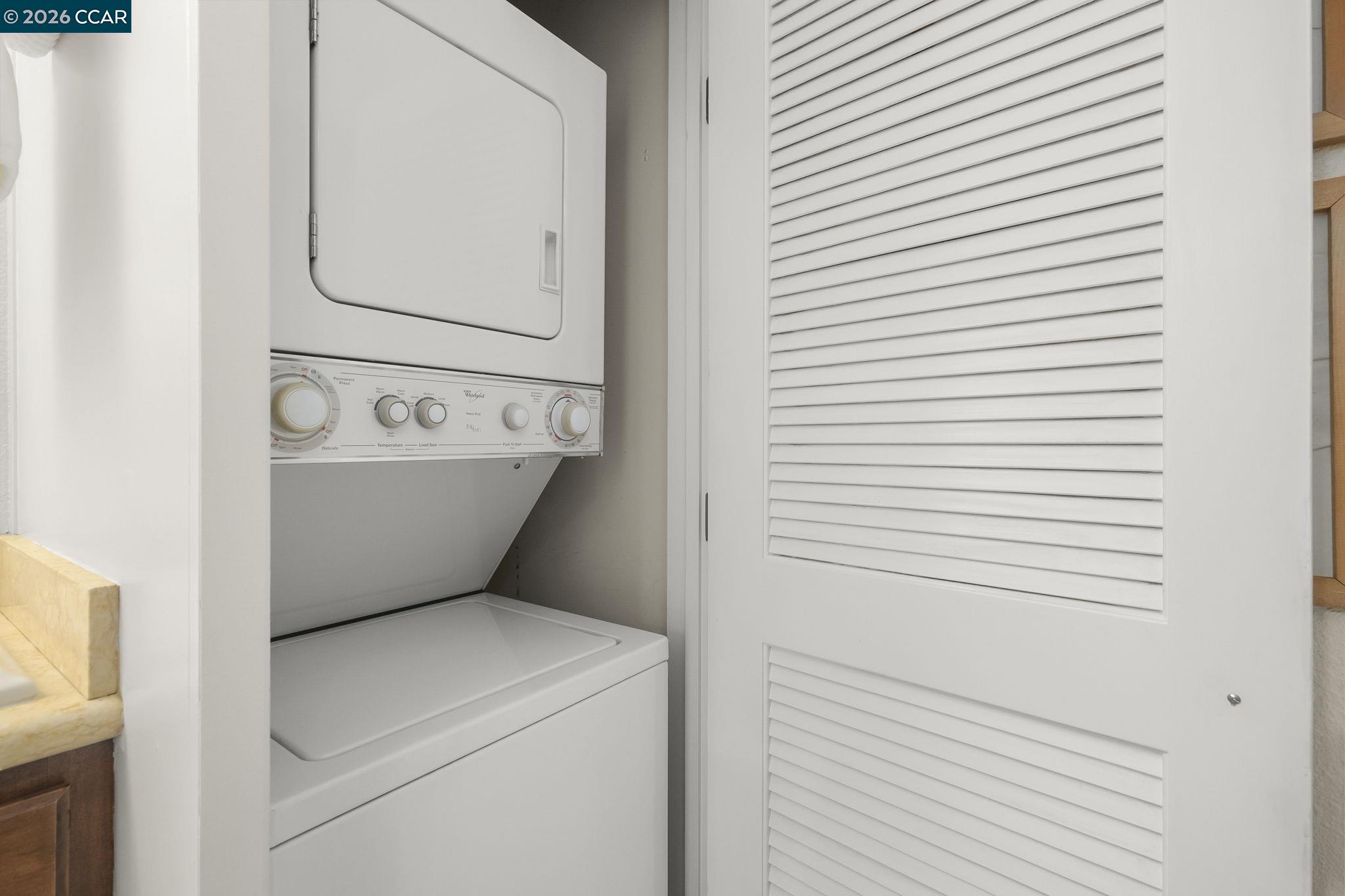 2057 Golden Rain Road, Unit 4 Walnut Creek, CA 94595 - Photo 16 of 20 a utility room with dryer and washer