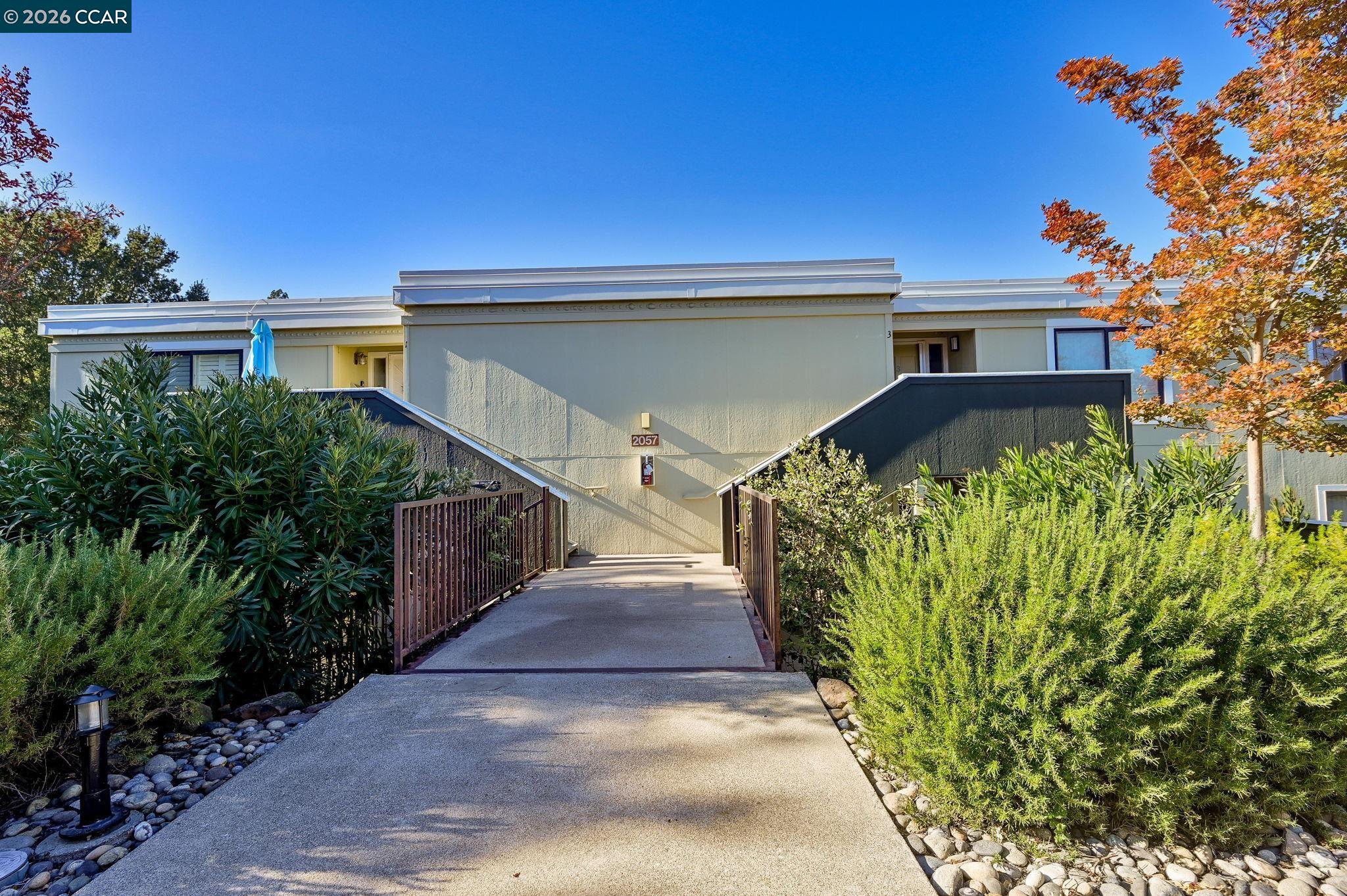 2057 Golden Rain Road, Unit 4 Walnut Creek, CA 94595 - Photo 2 of 20 a view of a house with a yard