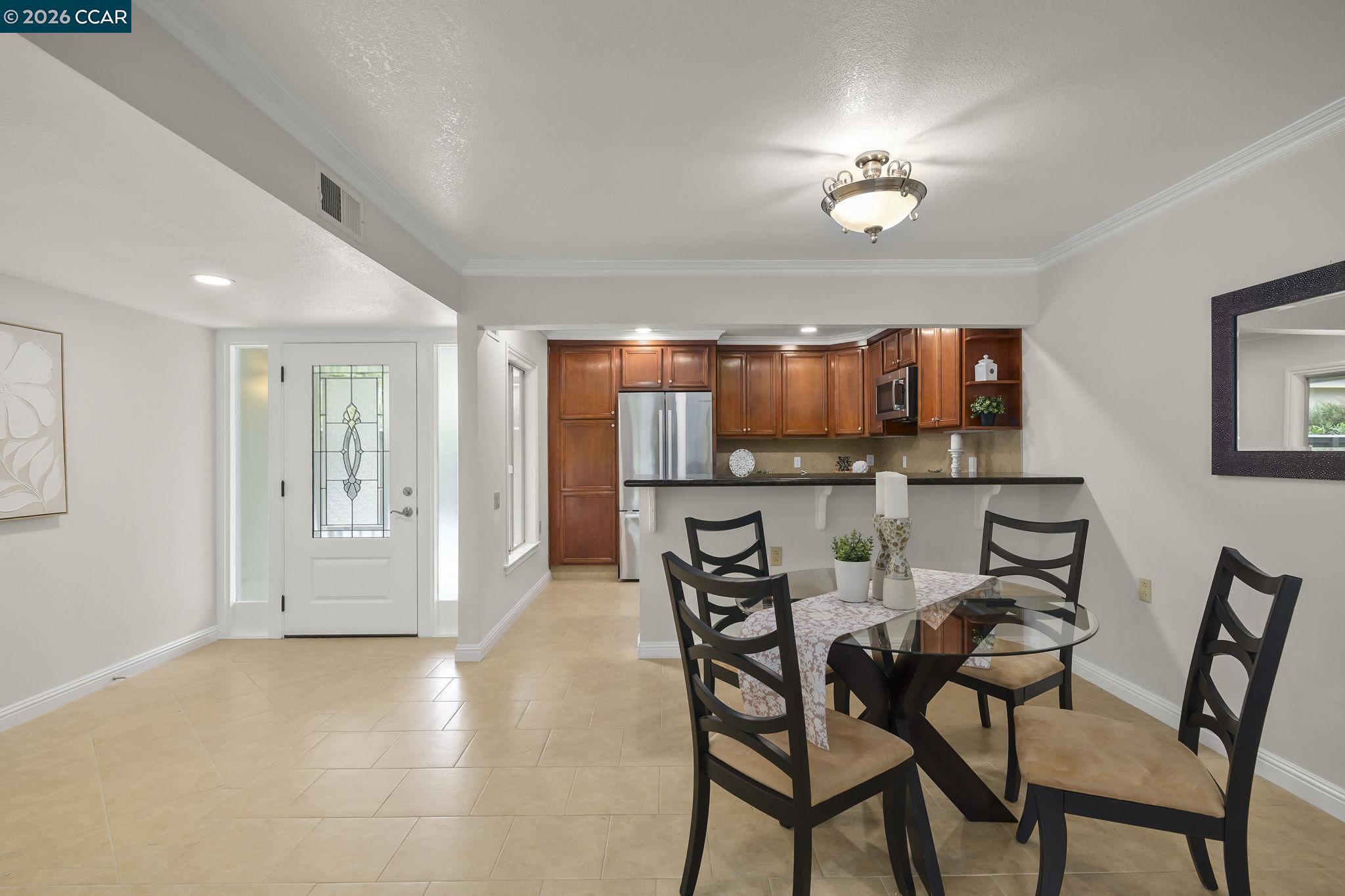 2057 Golden Rain Road, Unit 4 Walnut Creek, CA 94595 - Photo 5 of 20 a view of a dining room with furniture