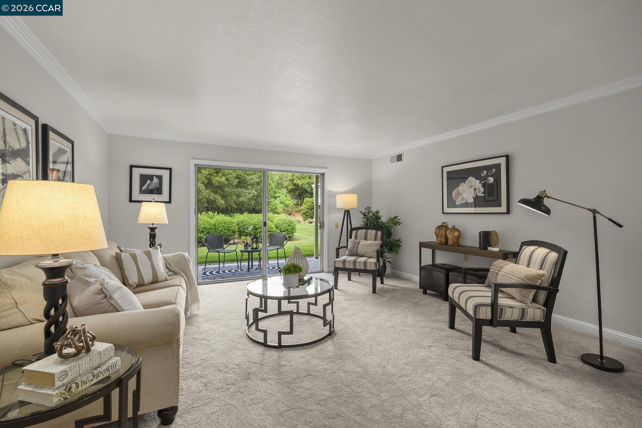 2057 Golden Rain Road, Unit 4 Walnut Creek, CA 94595 - Photo 6 of 20 a living room with furniture and a large window