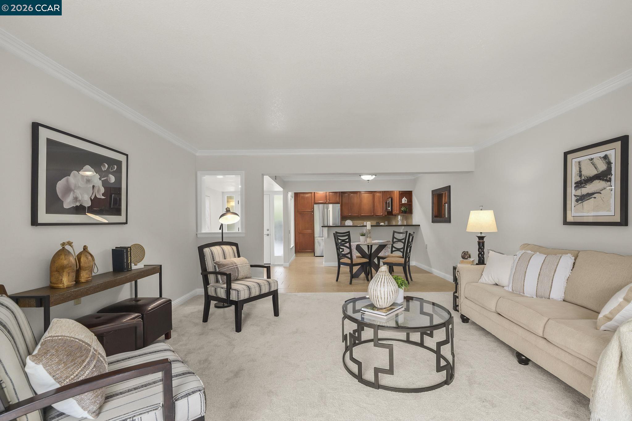 2057 Golden Rain Road, Unit 4 Walnut Creek, CA 94595 - Photo 8 of 20 a living room with furniture and a large window