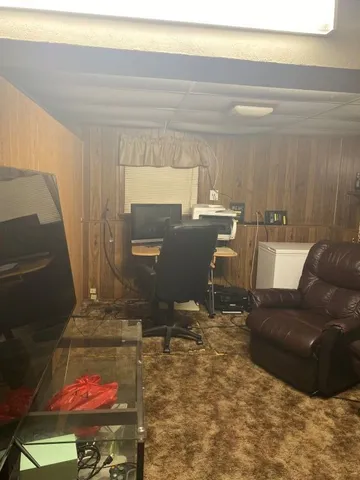 a living room with furniture and a rug