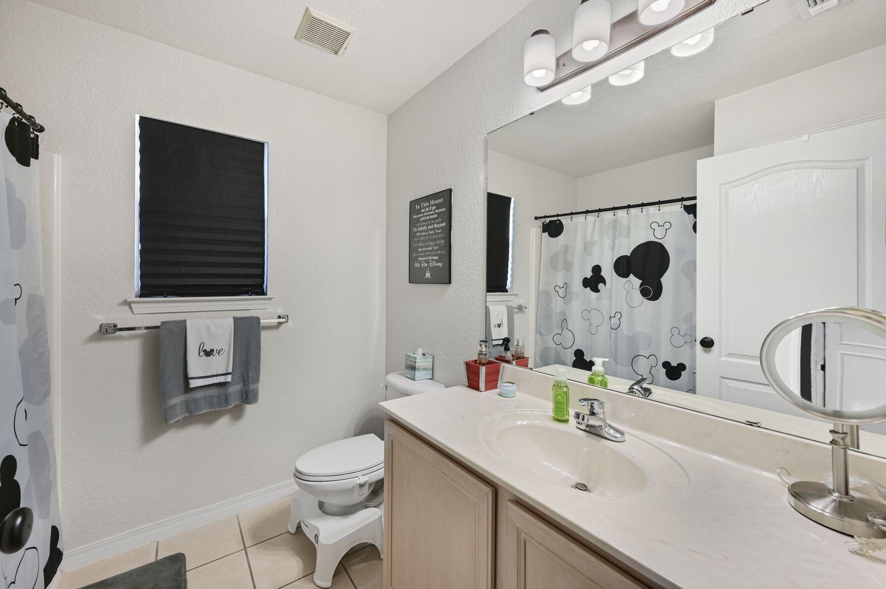374 Driftwood Point Road Santa Rosa Beach, FL 32459 - Photo 13 of 35 a bathroom with a sink a toilet and shower curtain