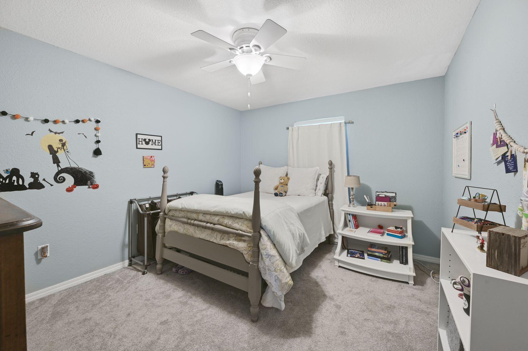 374 Driftwood Point Road Santa Rosa Beach, FL 32459 - Photo 14 of 35 a bed room with a bed and a chandelier