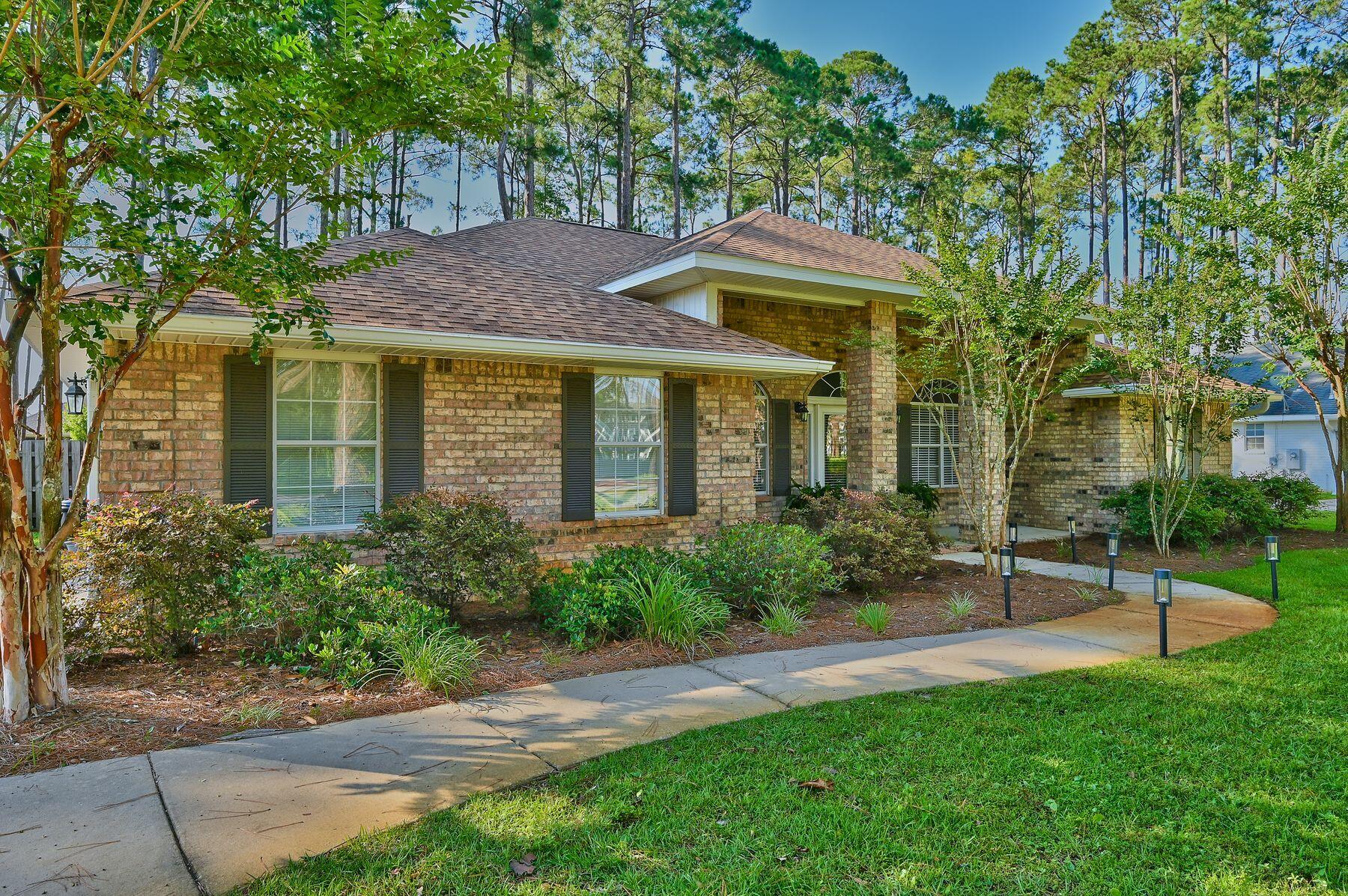 374 Driftwood Point Road Santa Rosa Beach, FL 32459 - Photo 3 of 35 a front view of a house with a garden