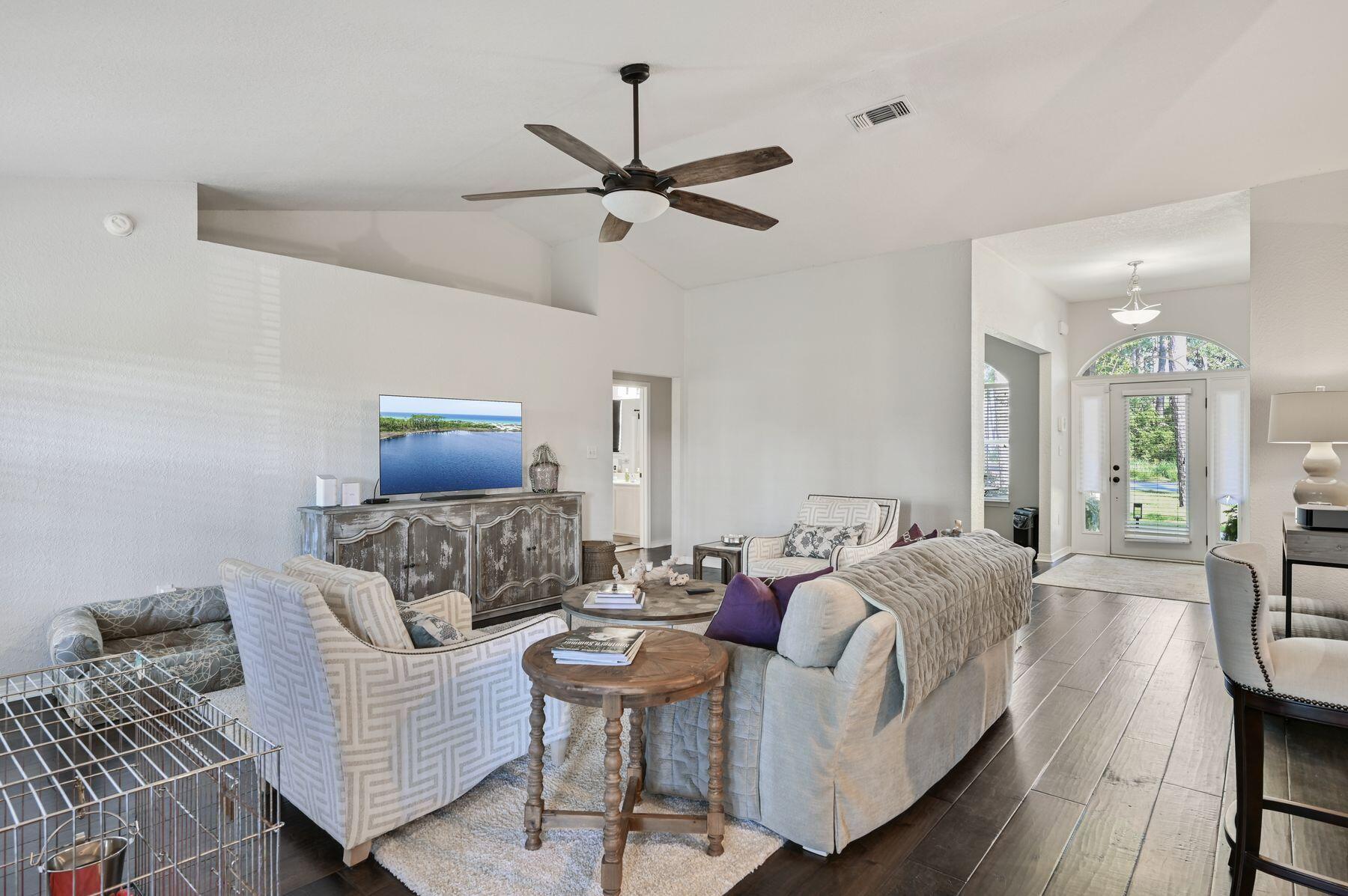 374 Driftwood Point Road Santa Rosa Beach, FL 32459 - Photo 6 of 35 a living room with furniture and a wooden floor