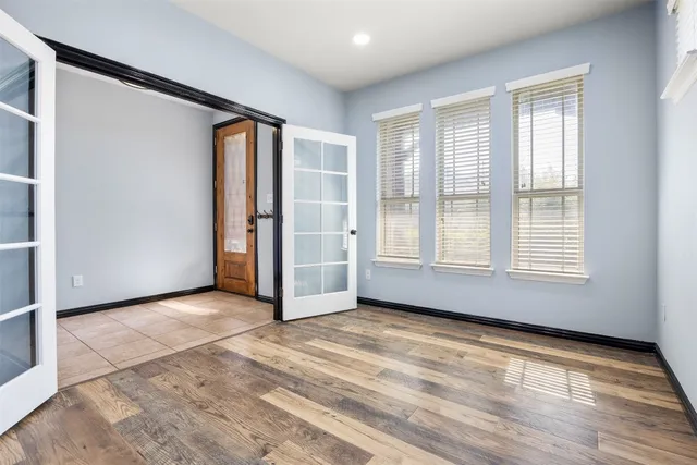 a kitchen with stainless steel appliances kitchen island granite countertop a stove a sink and a refrigerator