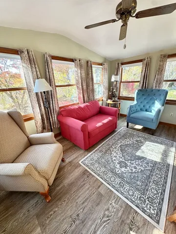 a living room with furniture and a rug