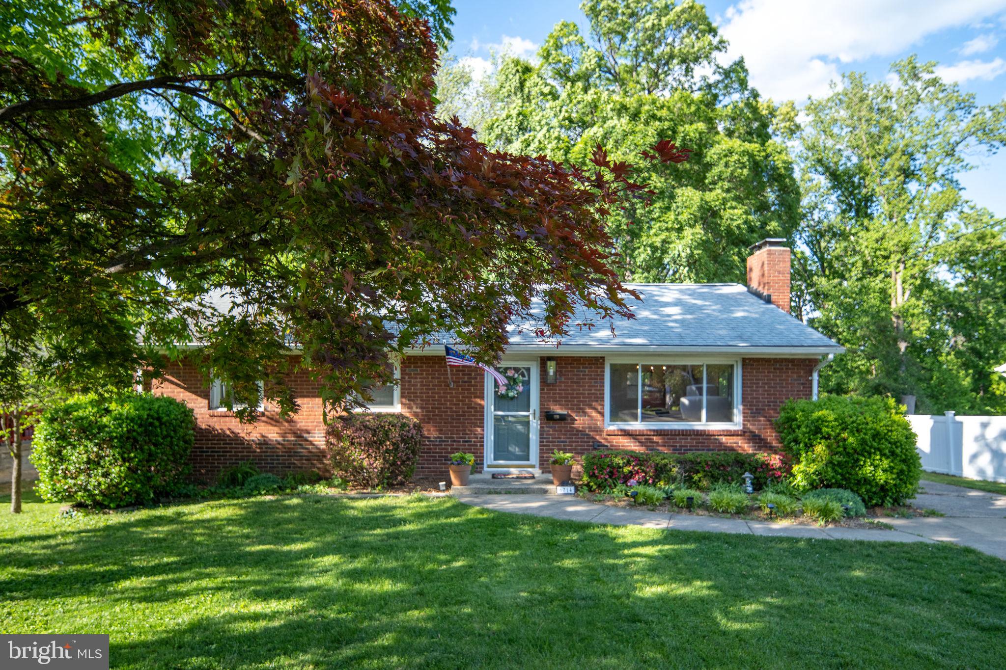 6714 Ruskin Street Springfield, VA 22150 - Photo 2 of 63 a front view of house with yard and green space