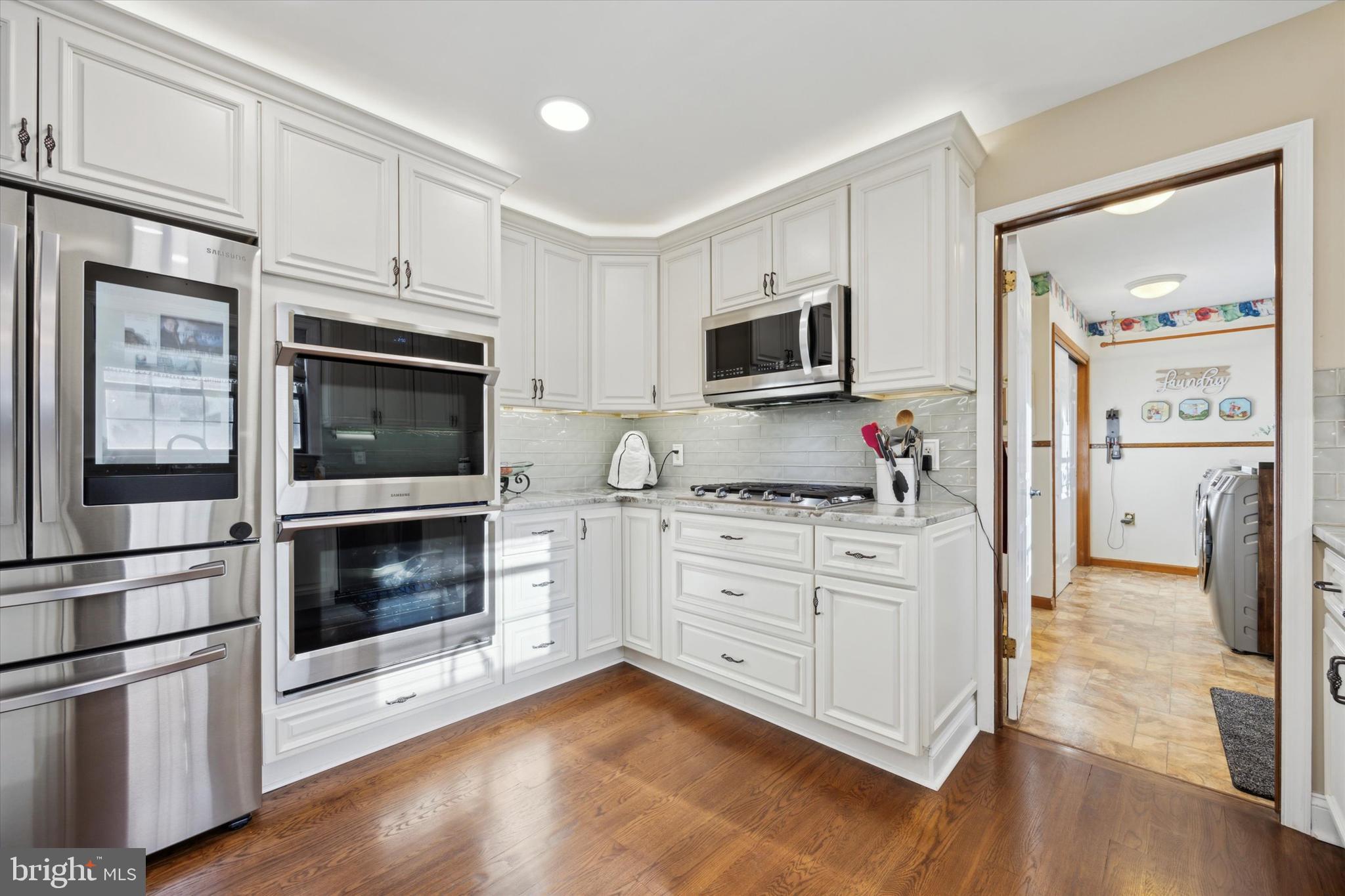 78 7 Stars Road Spring City, PA 19475 - Photo 23 of 117 a kitchen with stainless steel appliances white cabinets a stove and a refrigerator