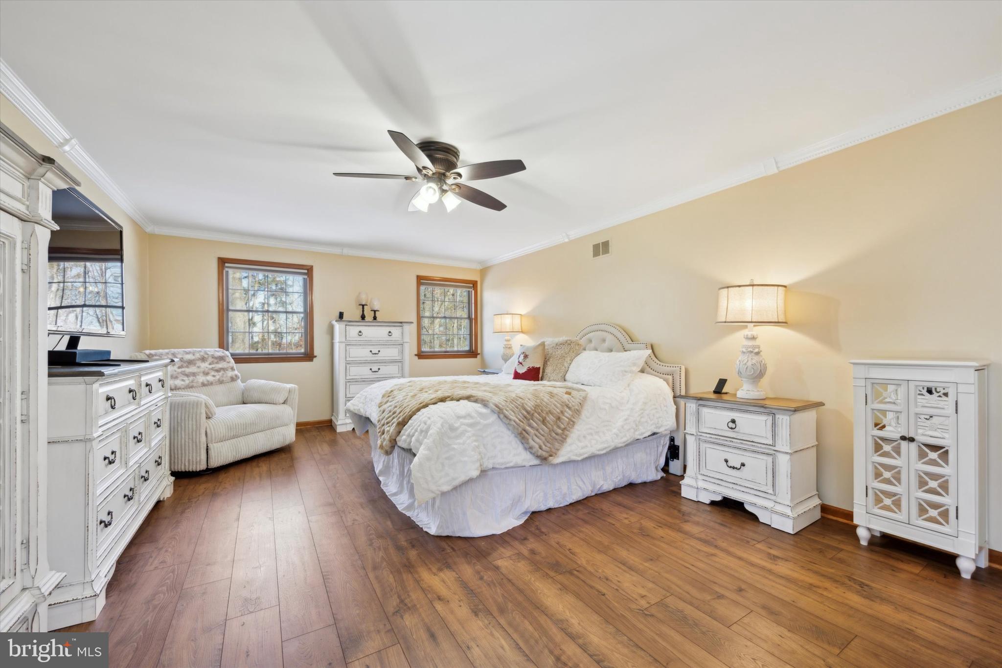78 7 Stars Road Spring City, PA 19475 - Photo 31 of 117 a spacious bedroom with a bed and a chandelier