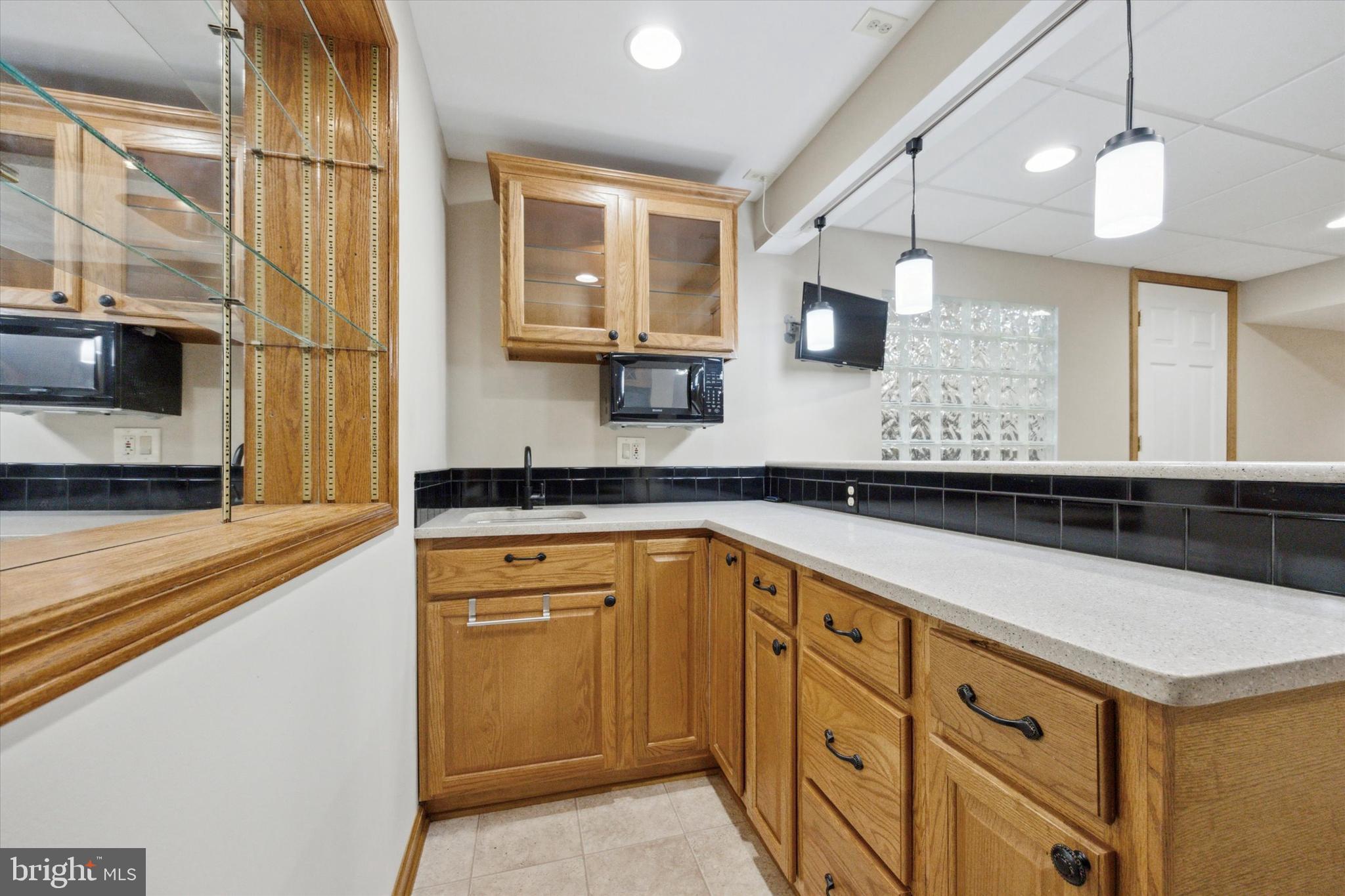 78 7 Stars Road Spring City, PA 19475 - Photo 60 of 117 a kitchen with granite countertop a sink a stove and cabinets