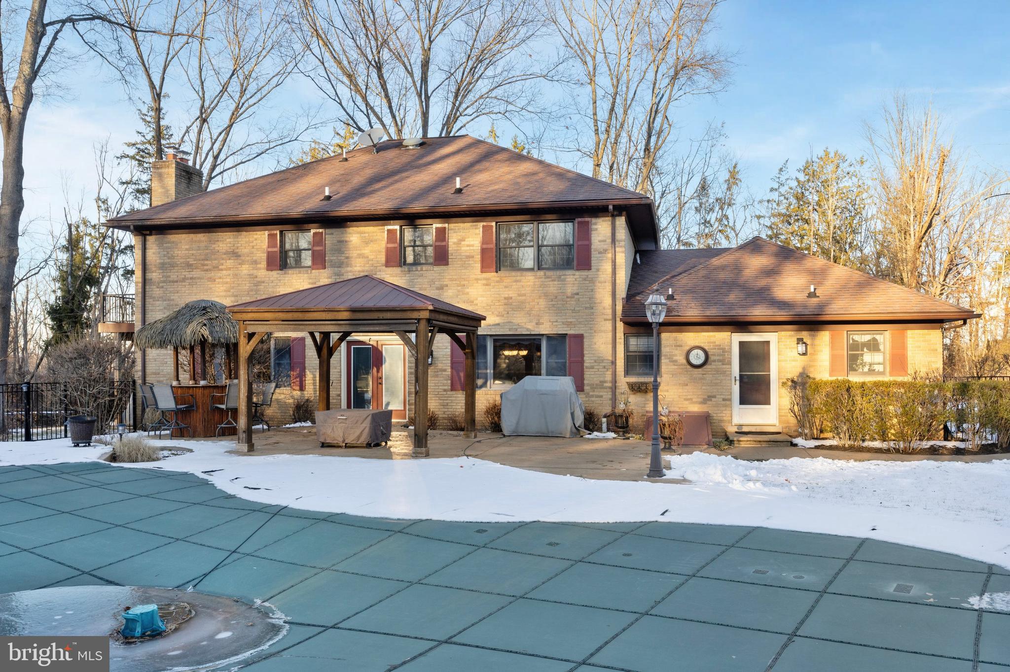 78 7 Stars Road Spring City, PA 19475 - Photo 81 of 117 a patio with a table and chairs under an umbrella