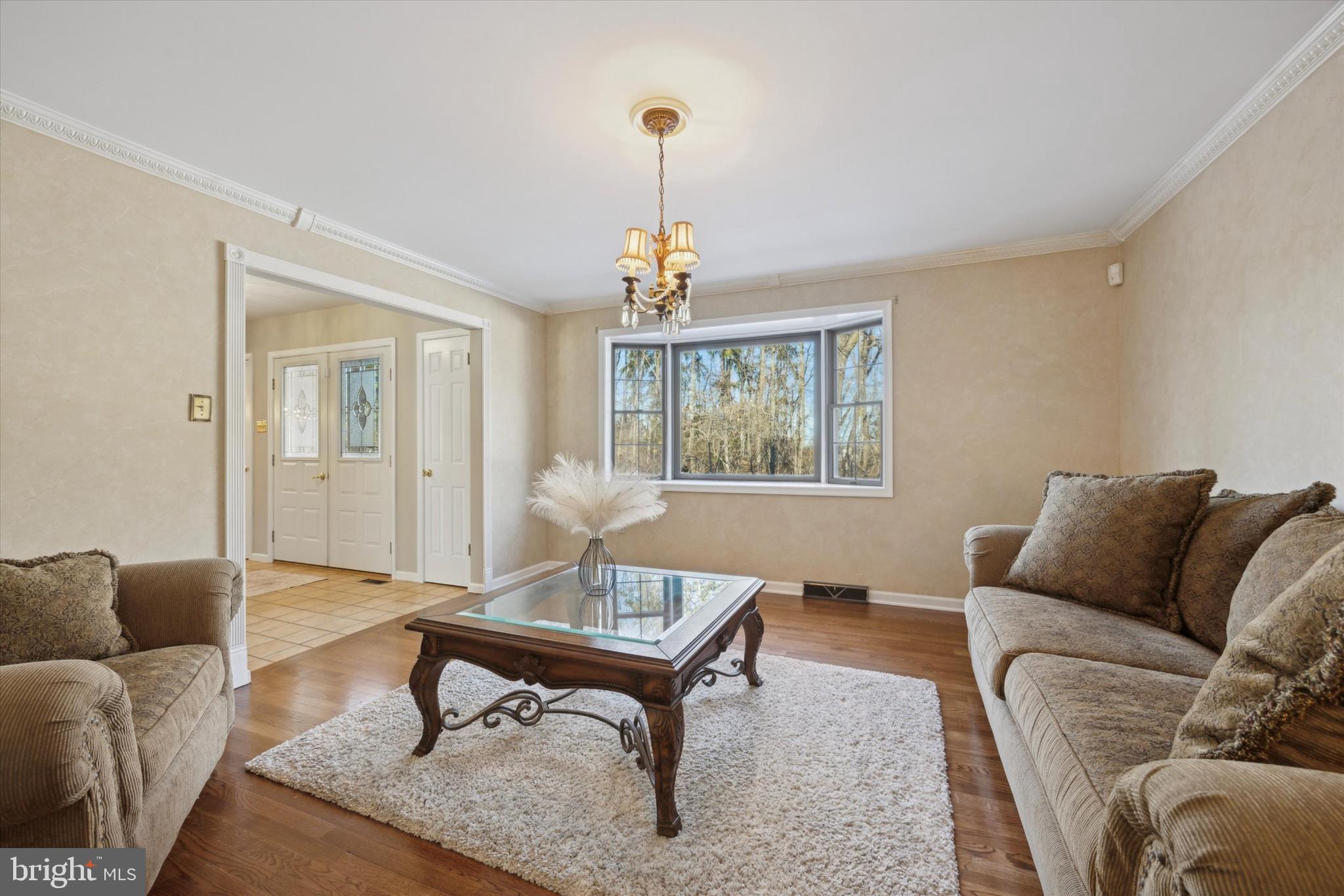 78 7 Stars Road Spring City, PA 19475 - Photo 9 of 117 a living room with furniture a window and a chandelier