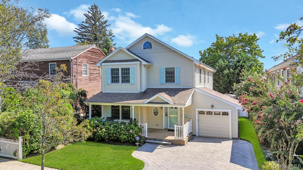 20 Prospect Avenue Port Washington, NY 11050 - Photo 1 of 1 a front view of a house with a yard and potted plants