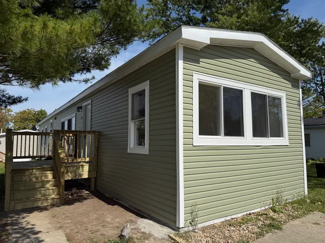 a kitchen with a sink cabinets and stainless steel appliances