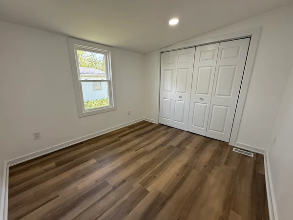a view of an empty room and window