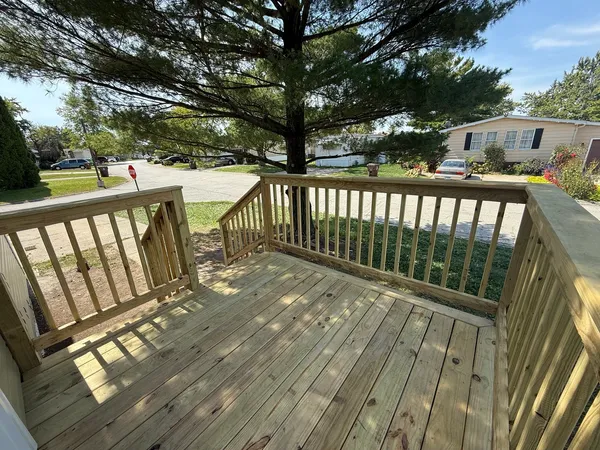 a view of deck with wooden floor and outdoor seating