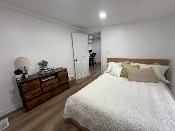 a bedroom with bed and window