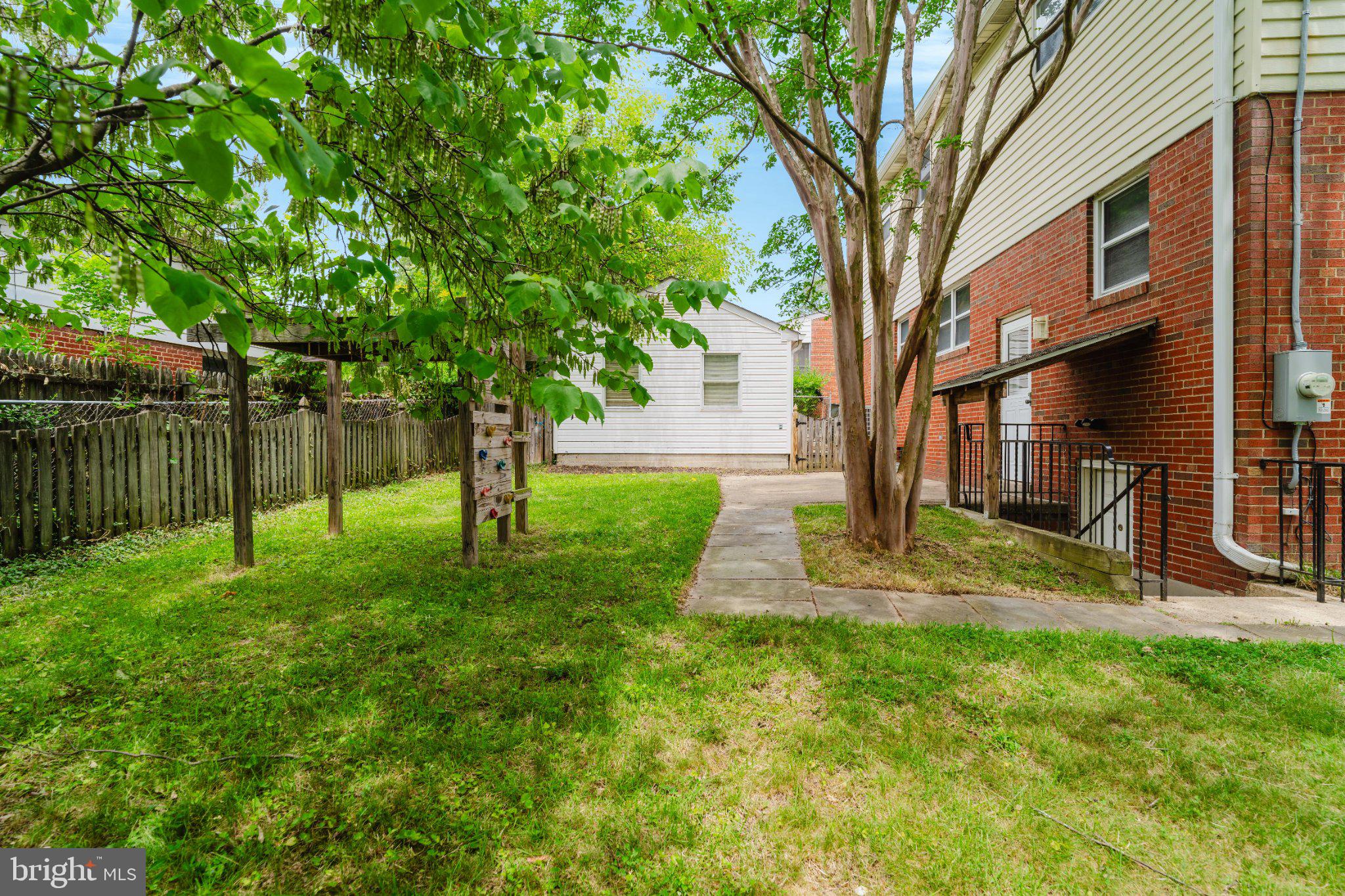 10200 Duvawn Place Silver Spring, MD 20902 - Photo 38 of 42 Lush green space with inviting pathways.