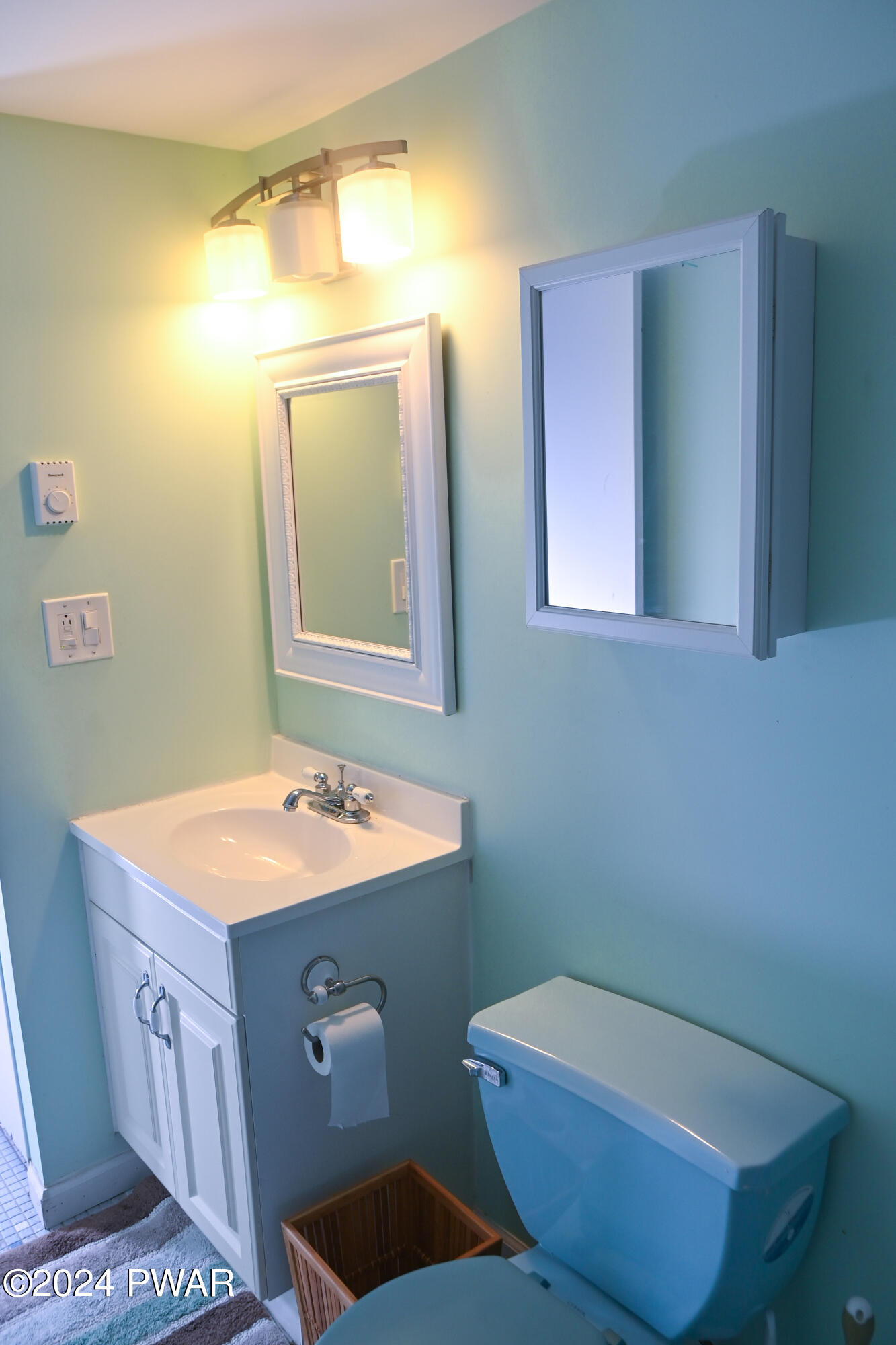 119 Pike Road Bushkill, PA 18324 - Photo 11 of 16 a bathroom with a sink and a mirror