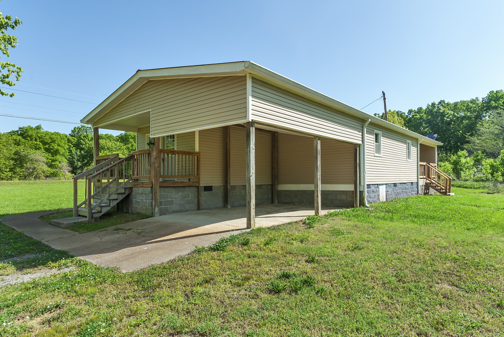 6146 Primm Springs Road Lyles, TN 37098 - Photo 3 of 18 Attached carport with concrete parking