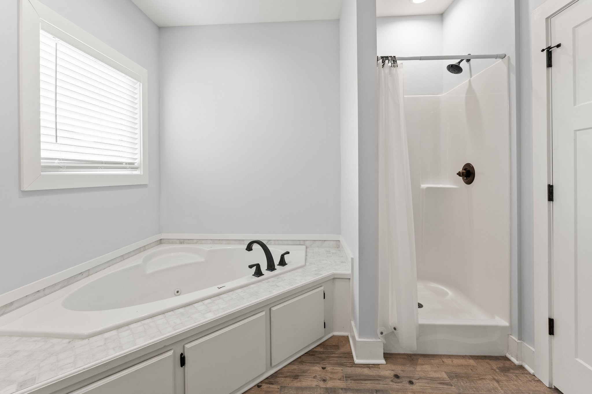 1295 Old Estill Springs Road Winchester, TN 37398 - Photo 19 of 34 a bathroom with a tub and shower