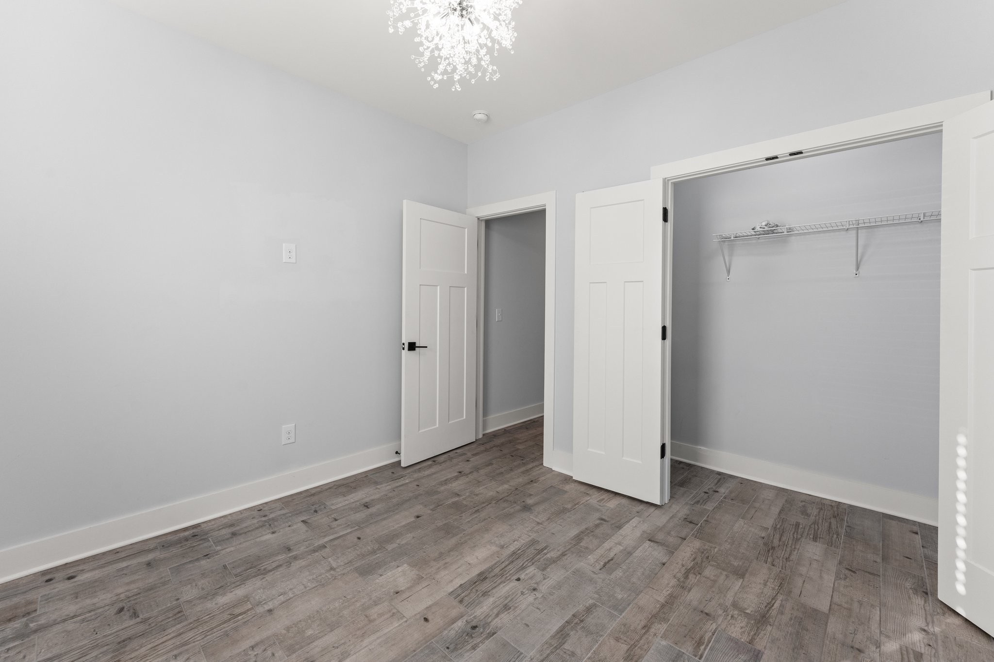1295 Old Estill Springs Road Winchester, TN 37398 - Photo 23 of 34 a view of an empty room with wooden floor