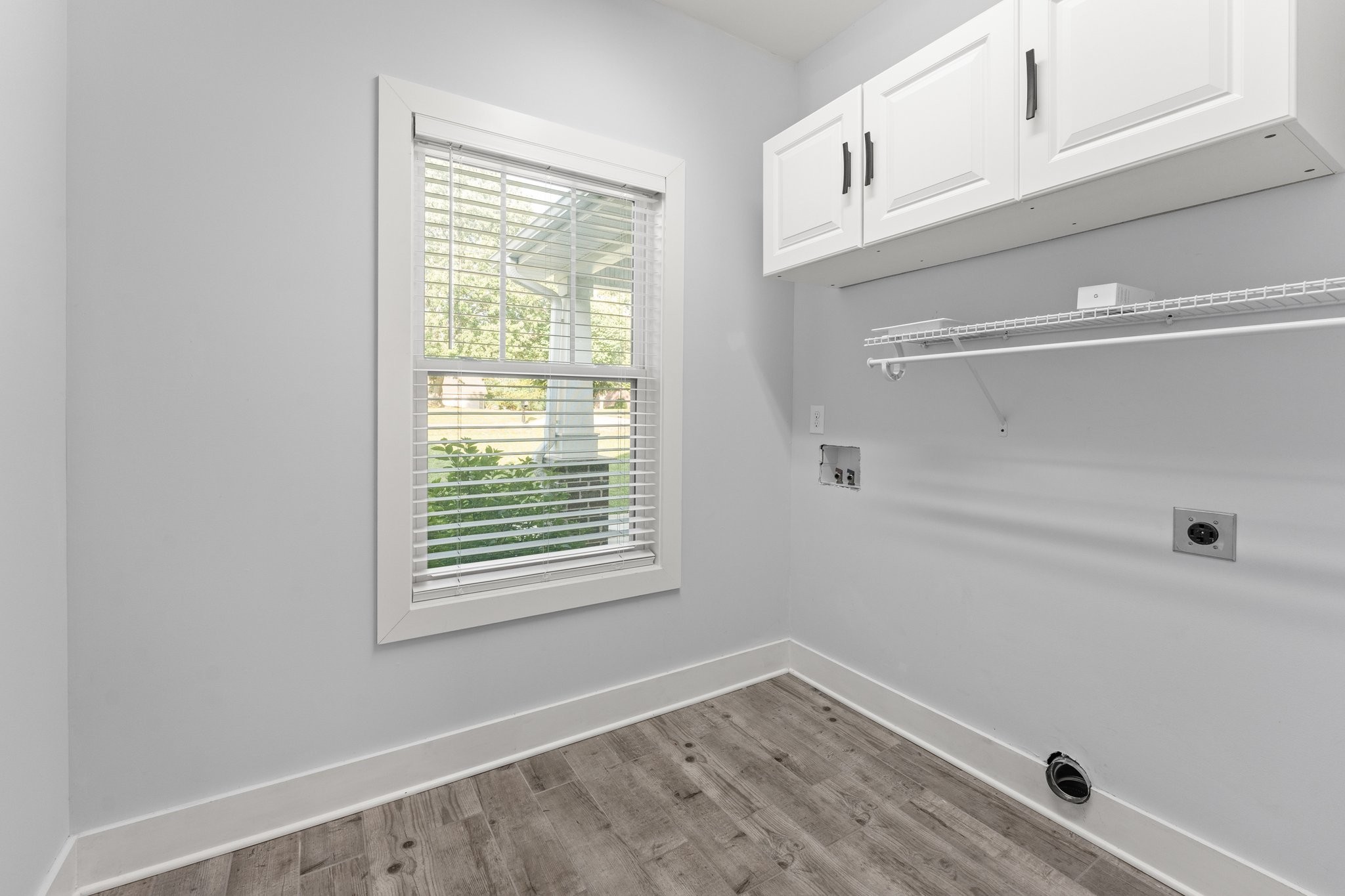 1295 Old Estill Springs Road Winchester, TN 37398 - Photo 27 of 34 a view of a kitchen with wooden floor and windows