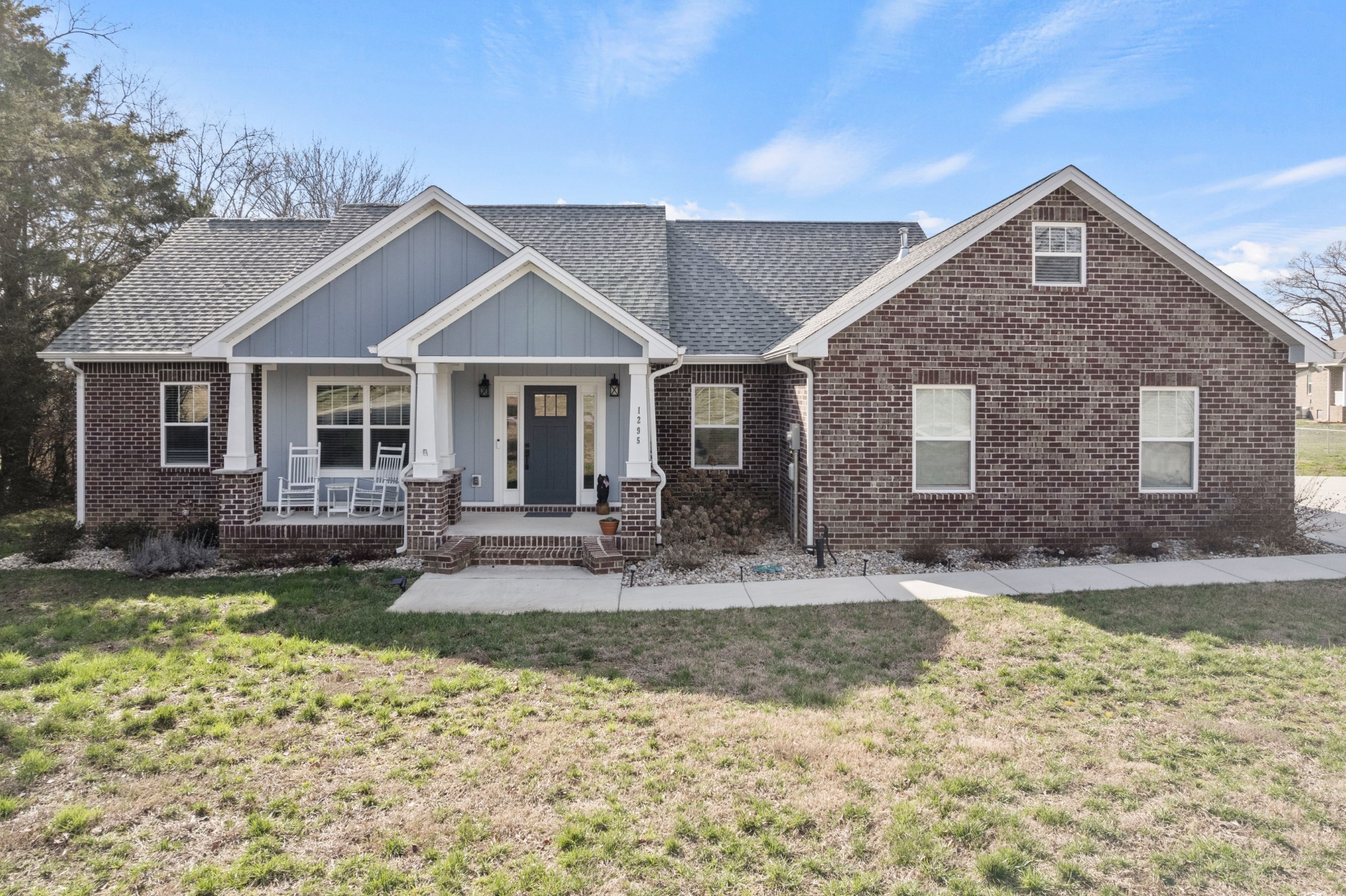1295 Old Estill Springs Road Winchester, TN 37398 - Photo 4 of 34 a front view of a house with garden