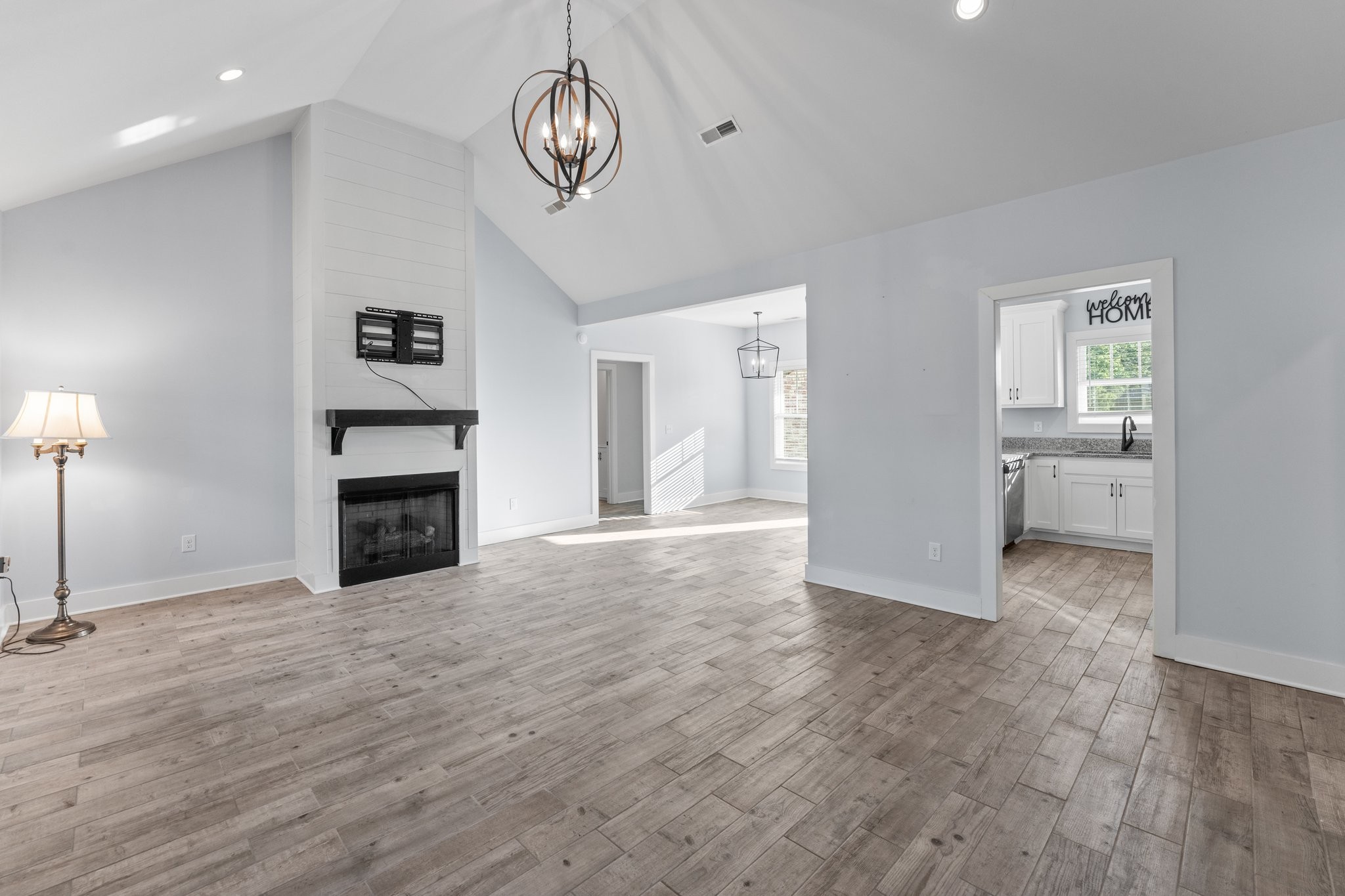 1295 Old Estill Springs Road Winchester, TN 37398 - Photo 5 of 34 a view of an empty room with a window and fireplace