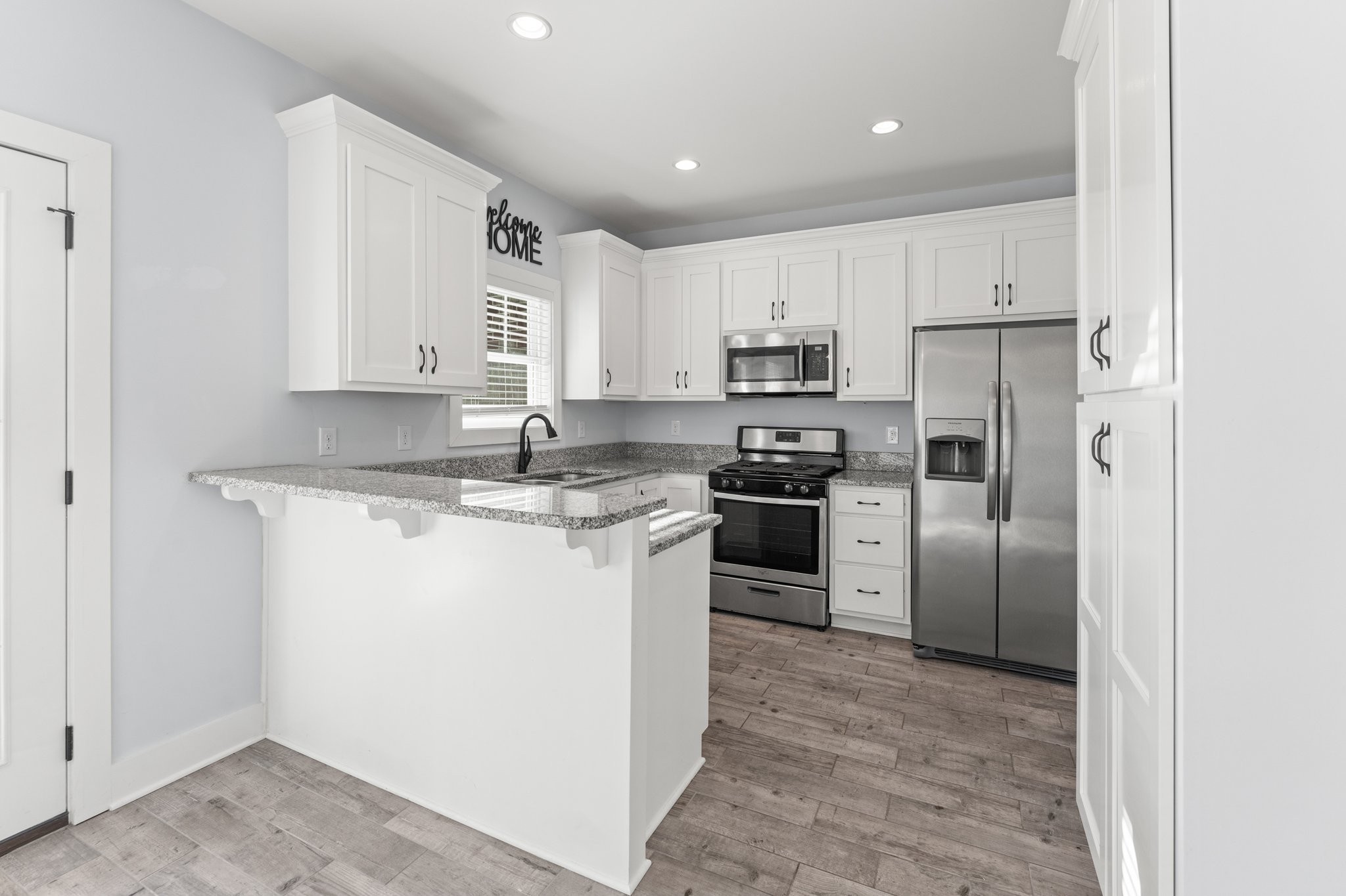 1295 Old Estill Springs Road Winchester, TN 37398 - Photo 9 of 34 a kitchen with a refrigerator sink and cabinets