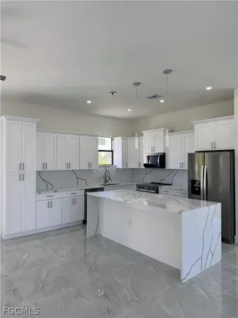 a kitchen with a stove and a microwave