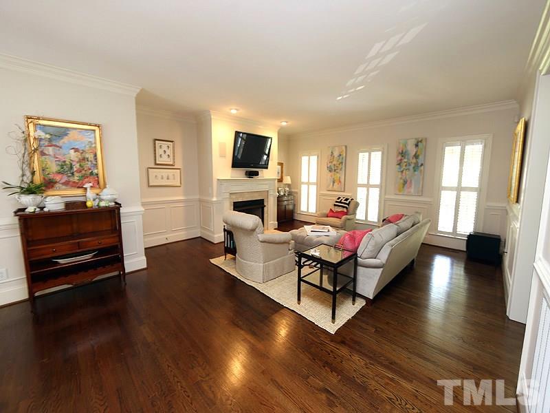 2805 Rothgeb Drive Raleigh, NC 27609 - Photo 11 of 25 a living room with furniture and a flat screen tv